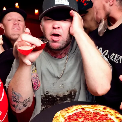 Image similar to fred durst puking on a pizza at a birthday party, woman looking disgusted in the background, 4 k,