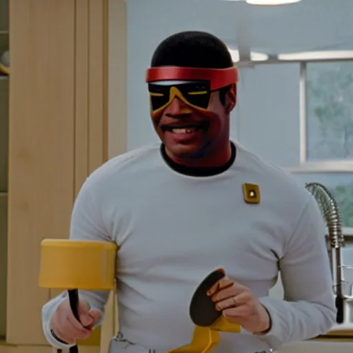 Image similar to Geordi LaForge wearing visor and a colander and random kitchen tools on his head