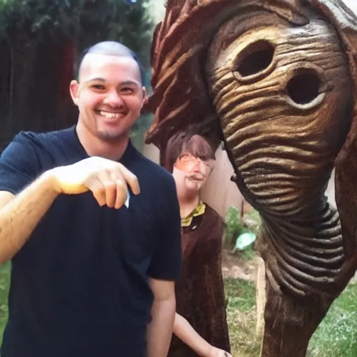 Prompt: a selfie of a guy smiling while standing next to the most disturbing thing imaginable