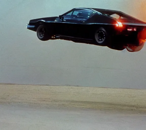 Image similar to a close - up, color cinema film still of knight rider kitt leaping over a jump, action cinematic.