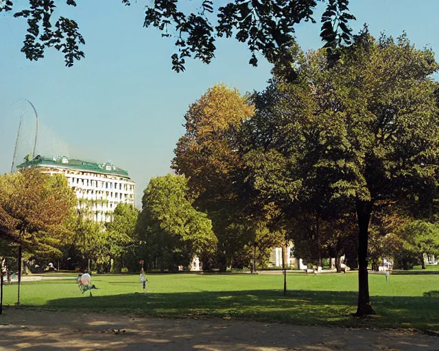 Image similar to a park with trees and buildings in the background, a photo by zlatyu boyadzhiev, deviantart, danube school, panorama, 1 9 9 0 s, creative commons attribution