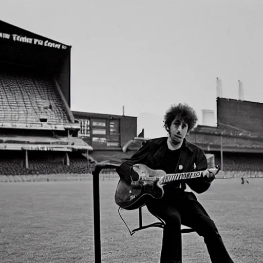 Image similar to bob dylan playing his guitar in the fulham football club stadium, photograph