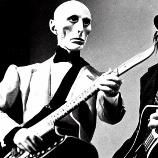 Prompt: count orlok playing guitar on stage next to robert fripp