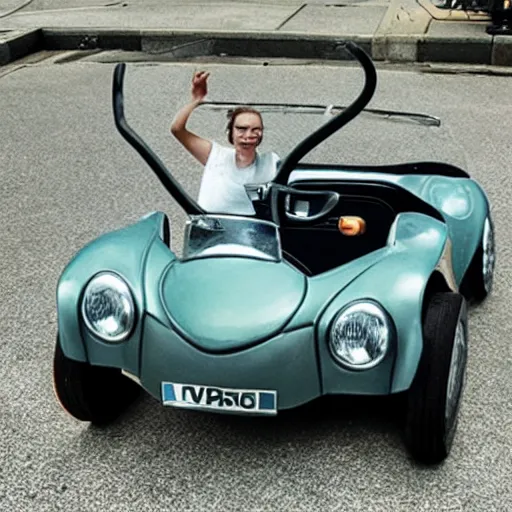 Image similar to photo of small mouse controlled convertible car