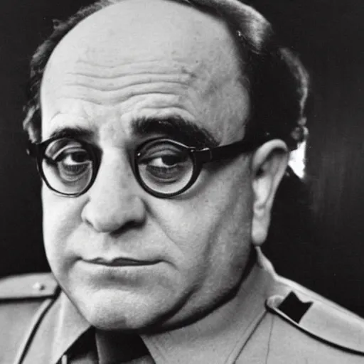 Image similar to 1942 portrait photograph, Danny DeVito in a Nazi officer's uniform