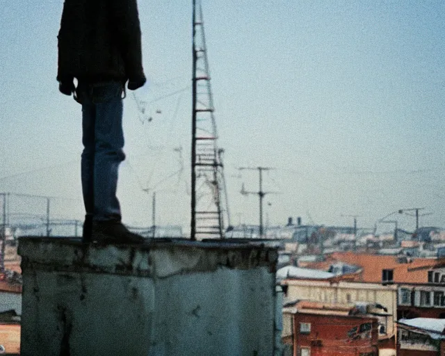 Image similar to lomo photo of man standing on the roof of soviet hrushevka, small town, cinestill, bokeh, out of focus