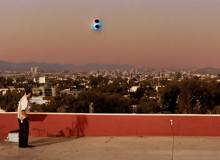 Prompt: film photograph, leica s, kodachrome, rooftop, los angeles, echo park, lake, landscape, blood moon, dusk, man smoking cigarette