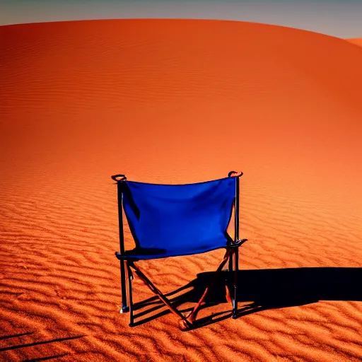 Image similar to a red camping chair in the middle of the sahara desert. the chair is far away from the camera.