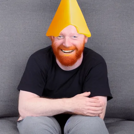 Image similar to drunk ginger haired man slouched on the couch smiling wearing a cone on his head