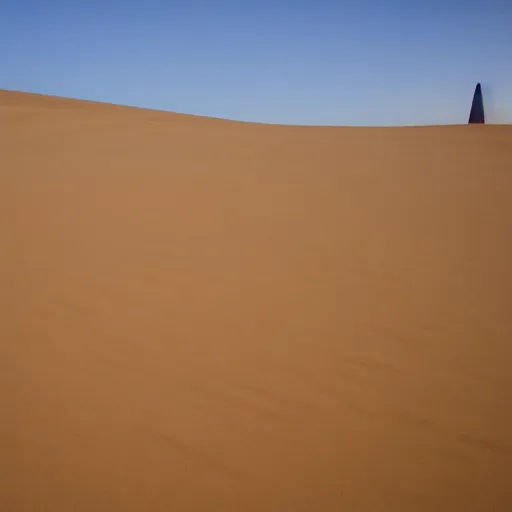 Image similar to a large sand dune with a large obelisk hovering in the middle of the sand dune. clear sky, grainy.