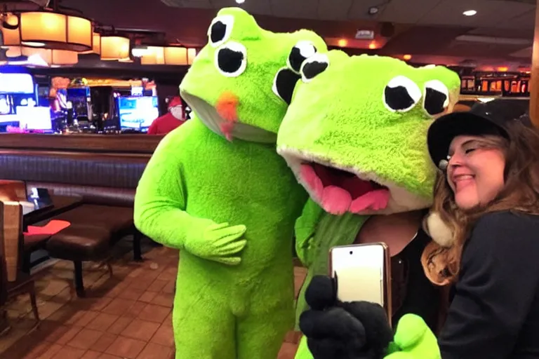 Prompt: taking a selfie with a frog fluffy mascot costume at an applebee's, cell phone photo