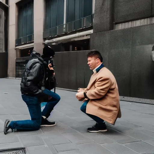 Prompt: person kneeled down taking a photograph of another person