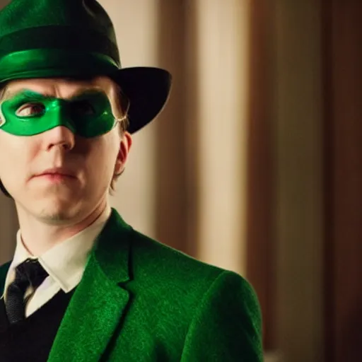Image similar to film still of Paul Dano as Riddler in a green suit and tie and green fedora no mask in The Batman, 4k, dark lighting, film noir, grainy, dark tone