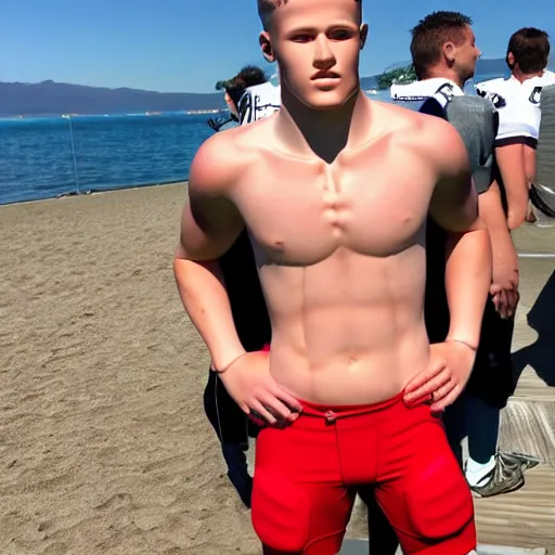 Image similar to a realistic detailed photo of a guy who is an attractive humanoid who is half robot and half humanoid, who is a male android, football player christian mccaffrey, shiny skin, posing like a statue, blank stare, by the beach, on display