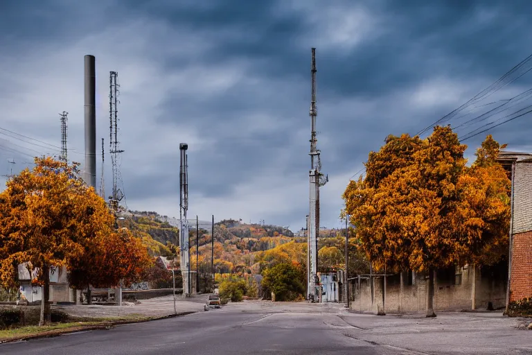 Image similar to warehouses on either side of a street, with an autumn hill directly behind, radio tower. Lens compression, photography, highly detailed