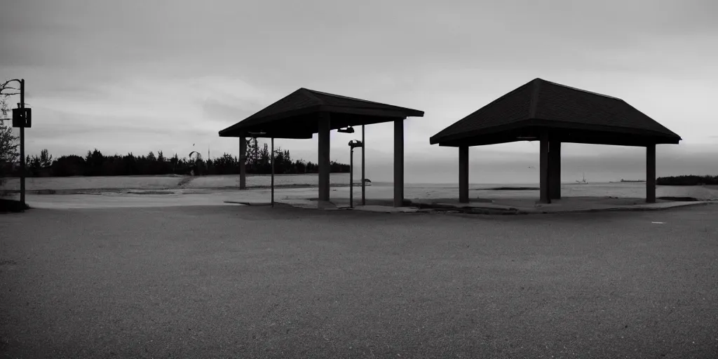 Image similar to a lonely port byron travel plaza in the middle of no where, sunset, eerie vibe, leica, 2 4 mm lens, 3 5 mm kodak film, directed by charlie kaufman, f / 2 2, anamorphic