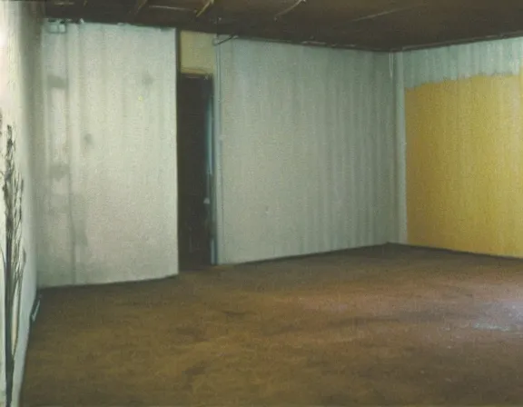 Prompt: medium size room with figure film still 1 9 9 2 industrial impressionism