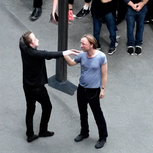 Prompt: edward norton taking thom yorke's hand and making him feel loved and needed.