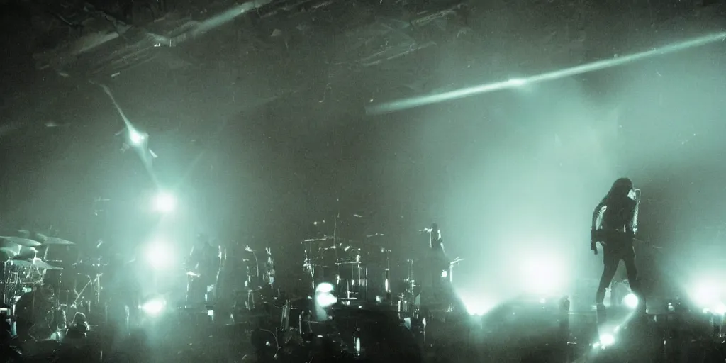 Image similar to dusty Trent Reznor smashing guitars, group of people on stage playing instruments, elaborate stage effects, dust, smoke, giant LED screens, colored projections, ultrafine detail, goth cybersuit, glowing thin wires, smoke, high contrast, projections, a screenshot by David Gilmour Blythe, holography, tesseract, volumetric lighting, anamorphic lens flare