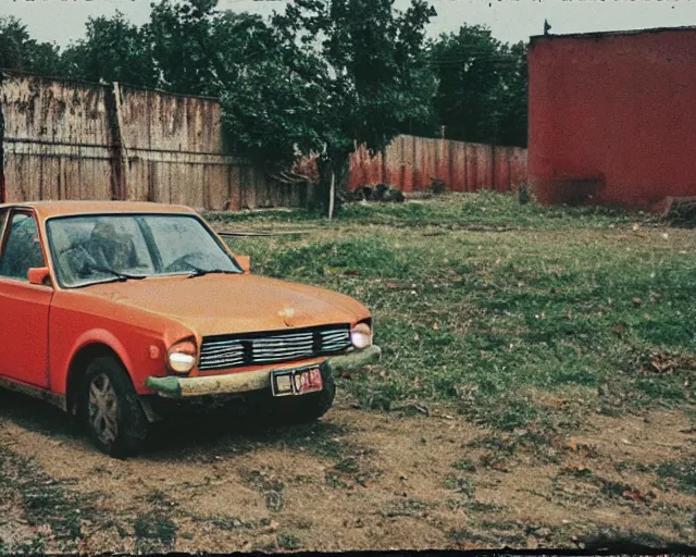 Image similar to a lomographic photo of old lada 2 1 0 7 standing in typical soviet yard in small town, hrushevka on background, cinestill, bokeh