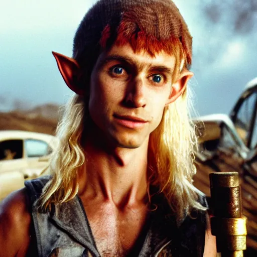 Image similar to close up headshot of a skinny high-fantasy elf with a long narrow face and spiky blonde hair wearing dark brown overalls and holding a bomb next to a destroyed car, high resolution film still, fim by Peter Jackson