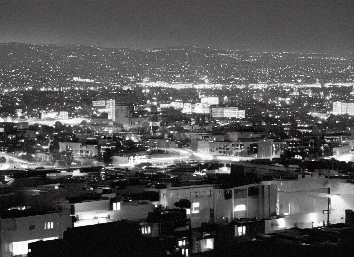 Image similar to a sprawling building complex seen from a dark parking lot in los angeles at night. 1 9 9 0 photo by james cameron