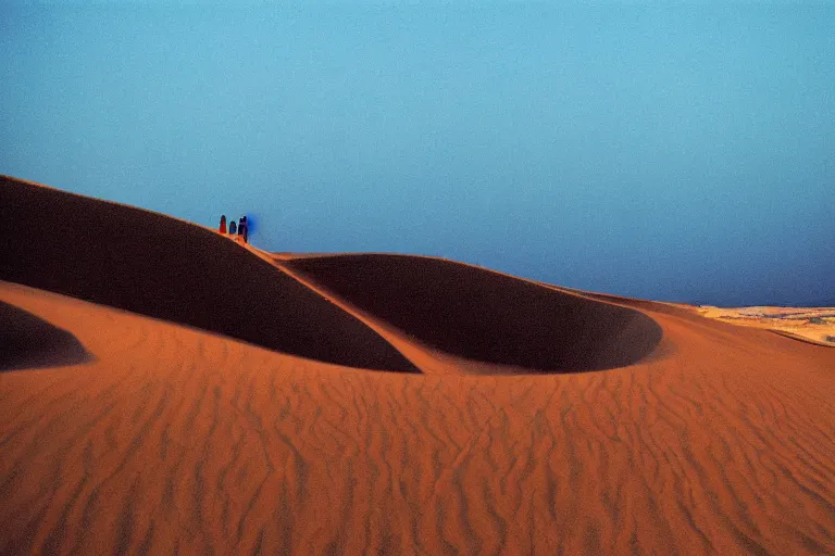 Image similar to blue hour, sand dunes beneath fire, 35mm, film photo, steve mccurry