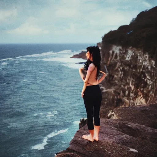 Image similar to kodak portra 4 0 0 photograph of a beautiful young woman standing on a cliff edge over the ocean, back view, arms raised, wavy dark hair, moody lighting, intricate geometric tattoo on her back, telephoto, 9 0 s vibe, blurry background, vaporwave colors, faded!