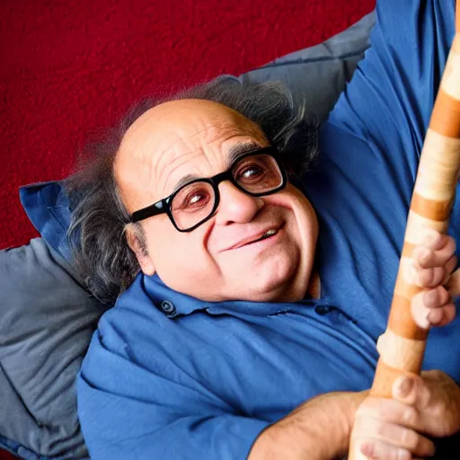 Prompt: Danny DeVito laying on a bed playing with his didgeridoo, cinematic, studio light, 8K,