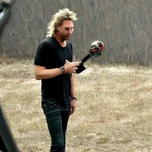 Image similar to chad robert kroeger of nickelback looking at a mystery object