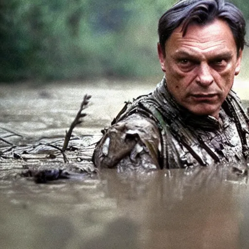 Image similar to film still of viktor orban as major dutch, covered in mud and hiding from the predator predator predator in swamp scene in 1 9 8 7 movie predator, hd, 4 k