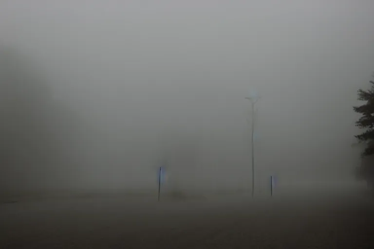 Image similar to Misty ghost town, with a dark shadow of ghosts