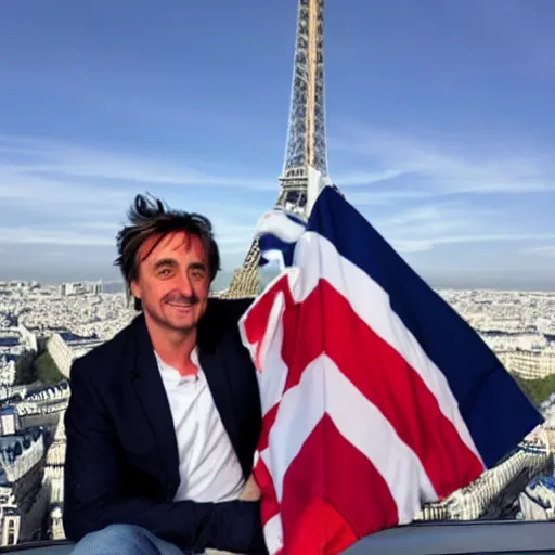 Image similar to Richard Hammond holding up the flag of america on top of the eiffel tower