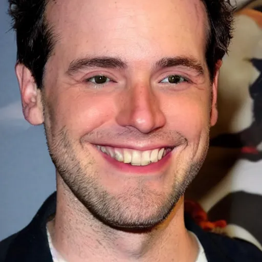 Image similar to Actor Matthew Hoffman without a beard is smiling at the camera