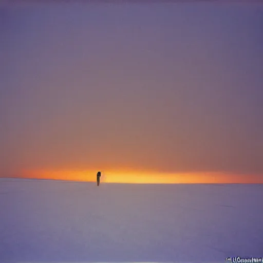 Prompt: photo of kansas flint hills covered in ice and snow, during a snowstorm. a old man in a trench coat and a cane appears as a hazy silhouette in the distance, looking back over his shoulder. cold color temperature. blue hour morning light, snow storm. hazy atmosphere. humidity haze. kodak ektachrome, greenish expired film, award winning, low contrast.