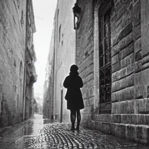 Prompt: fine art photograph of a woman seen from behind she is waiting for the rain to stop, cobblestone street, by henri cartier - bresson