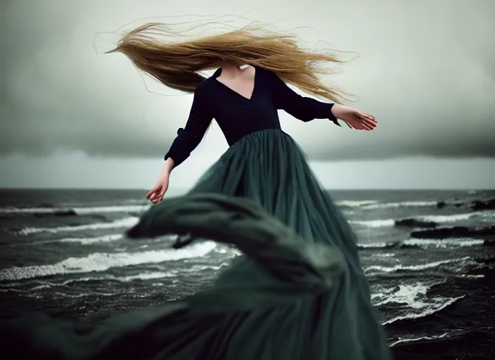 Image similar to cinestill 5 0 d half - length portrait photo portrait of a woman britt marling 3 / 4 style of nicholas fols, 1 5 0 mm, dress in voile, hair like dark clouds, hair in wind, head in focus, mute dramatic colours, soft blur outdoor stormy sea background, volumetric lighting, hyper detailed, hyper realistic