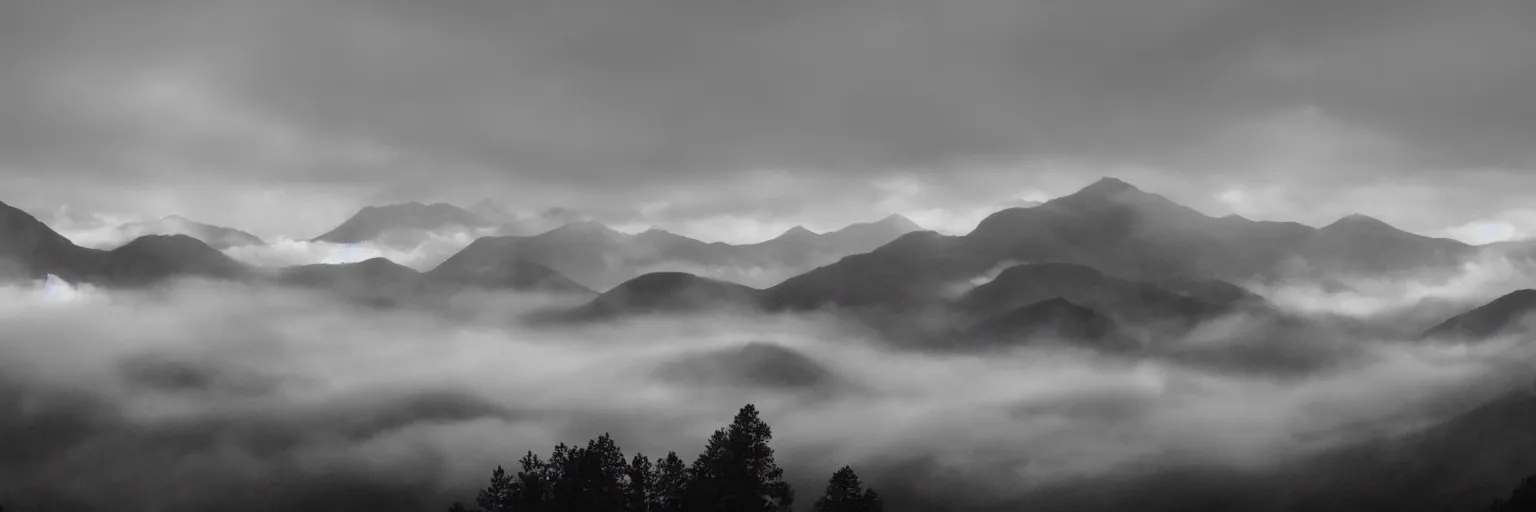 Prompt: monochrome photo of ambient and misty mountains