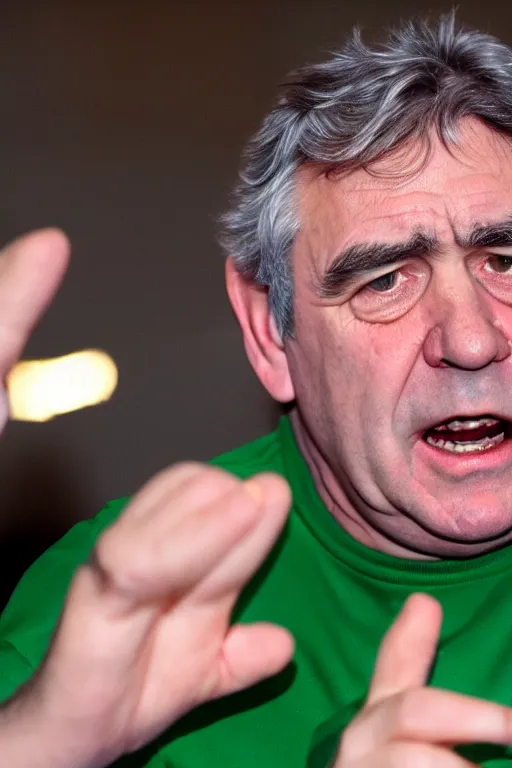 Prompt: gordon brown, his hair is black, wearing a green umbro tracksuit and gold necklace star with 1 3 points shaped medallion, hands raised in the air,