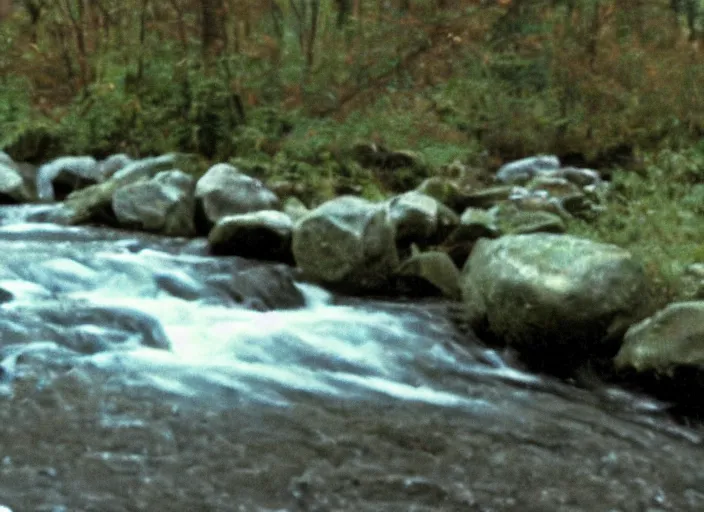 Prompt: very low quality blurry vhs footage of a river