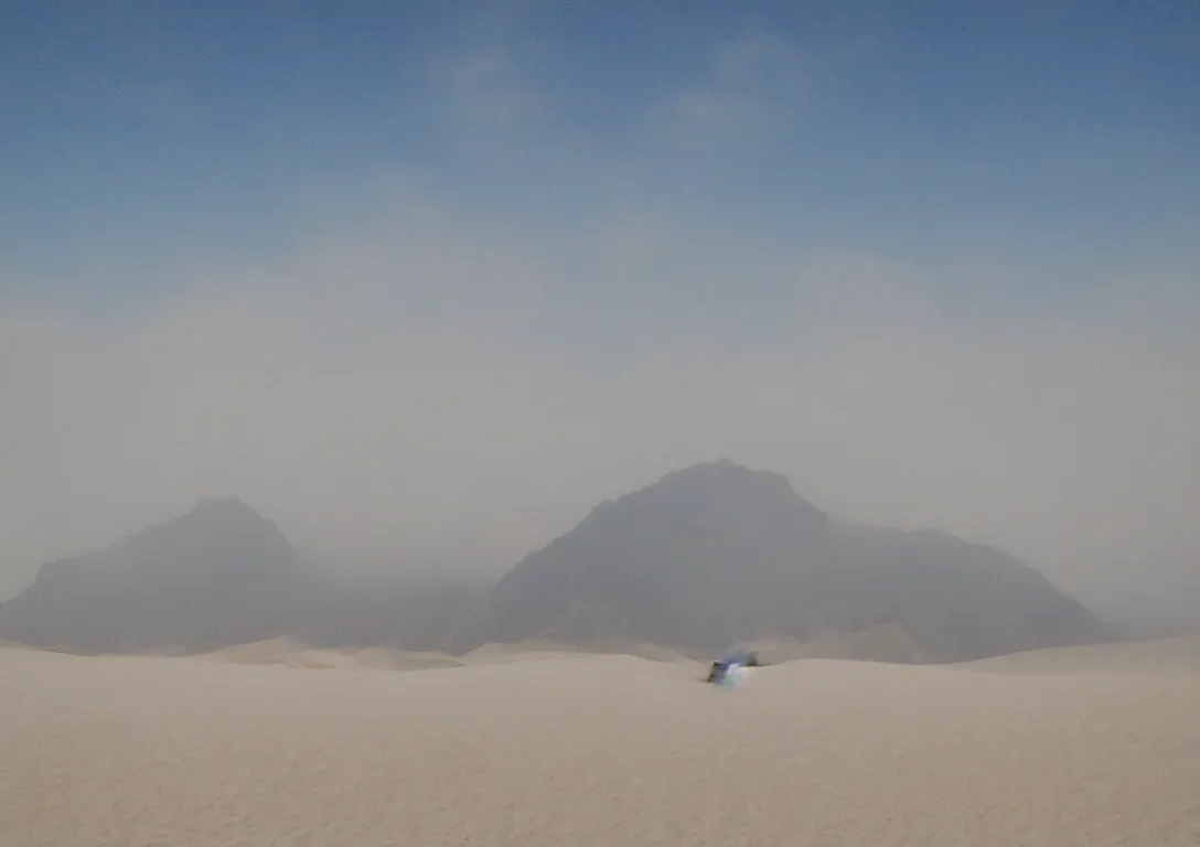 Prompt: ''white sand desert, mountains in the distance, mysterious, fog, majestic, hyper realism''