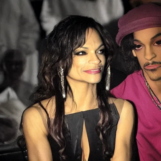 Image similar to a photo of prince looking at mayte garcia in low light. it's so dark, you can barely make out their features.