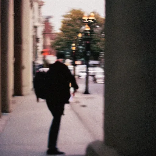 Image similar to portra 800 street photography, the subject is blurry because it's in motion, film portra photography