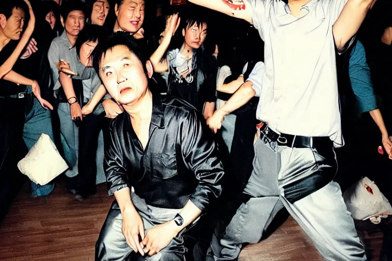 Prompt: a middle aged chinese dj with thick hair, wearing black trousers and grey shirt, in a nightclub. by david lachapelle