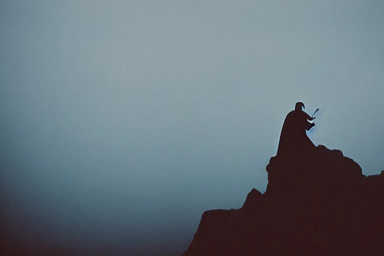 Image similar to darth vader on top of a tall mountain, blue fog, tornadoes surrounding, film photography, soft lighting, vignette