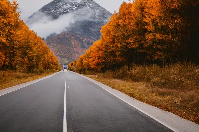 Prompt: a road with warehouses on either side, and an autumn mountain behind it with a radio tower on top. Lens compression, photography highly detailed