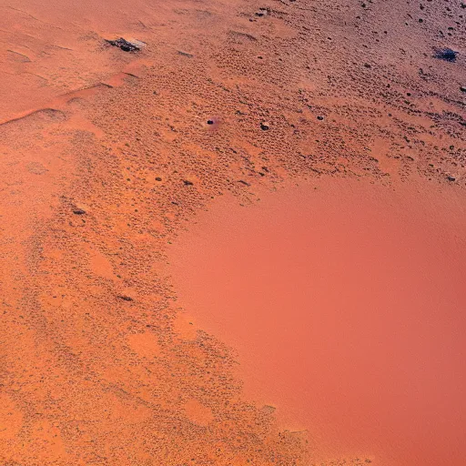 Prompt: very high resolution, fine detail, 4 k, aerial photo looking down from above on a large crater with a city around it, on the surface of planet mars, with red desert dunes