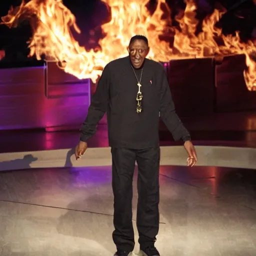 Prompt: arsonist arsenio hall lighting a hall on fire