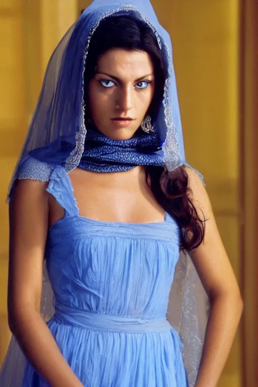 Image similar to young Monica Belluci as an Arab woman, tanned skintone, bright blue eyes, white veil, serious face, light blue decent dress, closeup