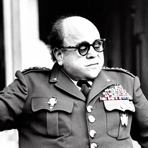 Image similar to Danny DeVito as a WW2 era American general watching a mushroom cloud explode